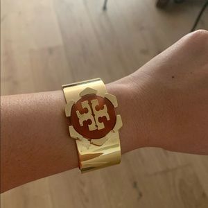 Tory Burch gold bracelets with emblem